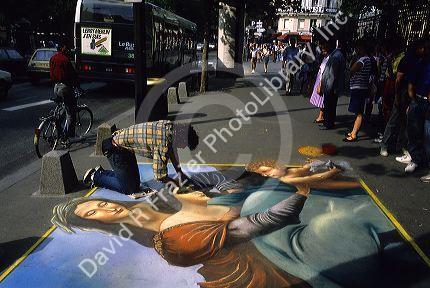 A sidewalk artist in Paris, France.