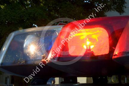 Flashing lights on top of a police car.