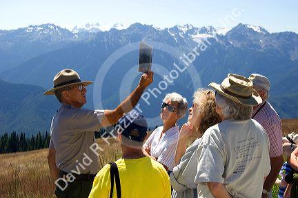 A park ranger talks to visitors at Olympic National Park, Washington.