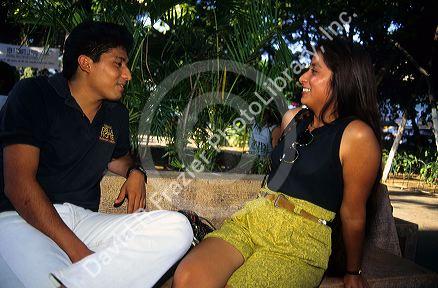 A mexican man and woman having a conversation in Mexico City, Mexico.