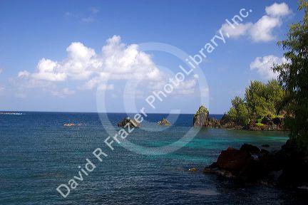 Ocean kayaking in the pacific off the island of Maui, Hawaii in Hana Bay.