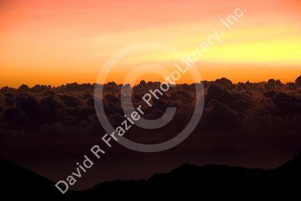 Sunrise above the clouds on Mount Haleakala on the island of Maui, Hawaii.