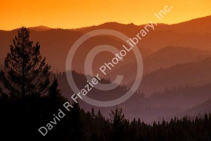 Hazy mountains and forest at sunset in Central Idaho.