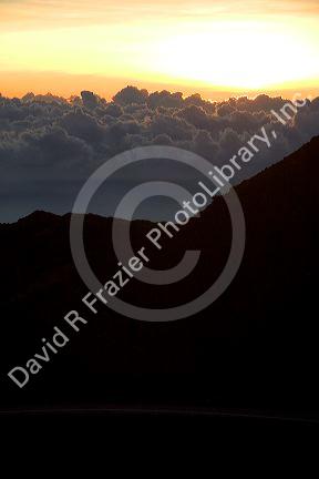 Sunrise above the clouds atop Mount Haleakala on the island of Maui, Hawaii.