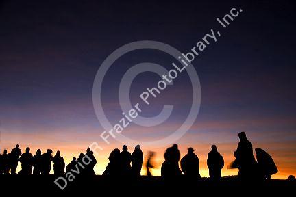 Tourists await the sunrise atop Haleakala Crater on the island of Maui, Hawaii.