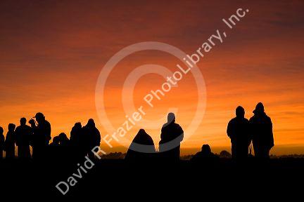 Tourists await the sunrise atop Mount Haleakala on the island of Maui, Hawaii.