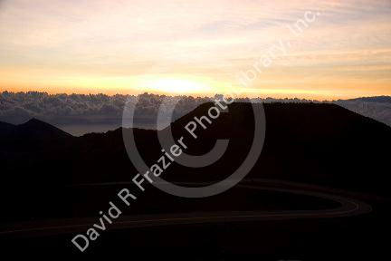 Sunrise above the clouds atop Mount Haleakala on the island of Maui, Hawaii.