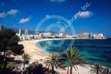 Hotels line Maqalluf beach in Majorca, Spain.