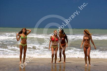 Girls in bikinis on the beach at Pinamar, Argentina.