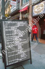 Menu board in front of a Spanish restaurant in Madrid, Spain.