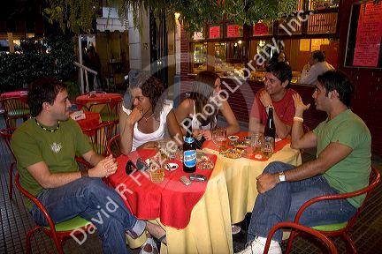 Young Argentine adults having drinks in Buenos Aires, Argentina. (model released)