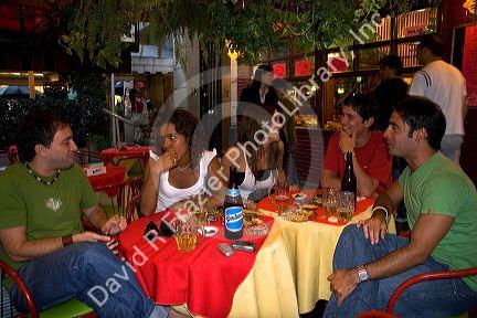 Young Argentine adults having drinks in Buenos Aires, Argentina. (model released)