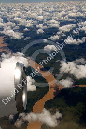 Airplane jet engine and clouds above the Rio Plata delta north of Buenos Aires, Argentina.
