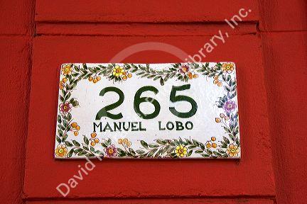 Painted tile with street address in Colonia, Uraguay.
