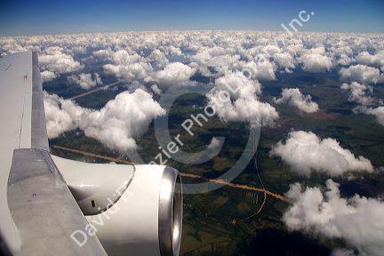 Airplane jet engine and clouds above Argentina and the pampas north of Buenos Aires.