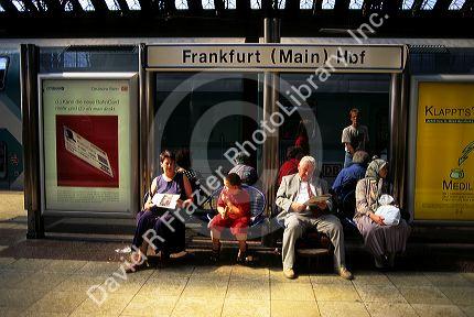 Passengers waiting at the train station in Frankfurt, Germany.