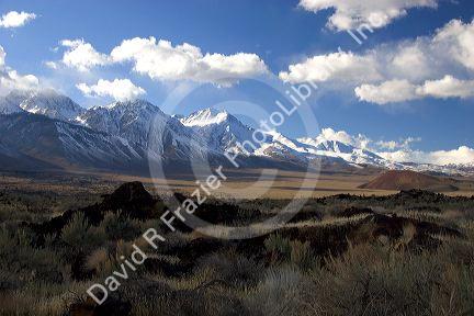 Snow covered Sierra Mountains in the Owens Valley, California with airid desert in foreground.