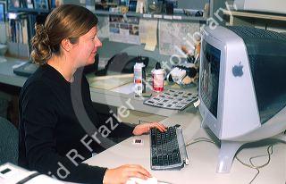 Female working on computer in office.
