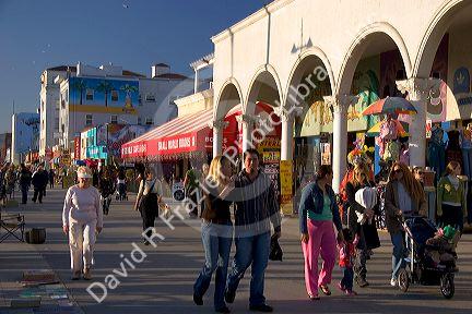 Visitors and tourists stroll along Venice Beach in Los Angeles, California.