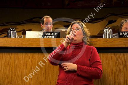 Woman translates in sign language at a meeting of Boise City Council, Idaho.