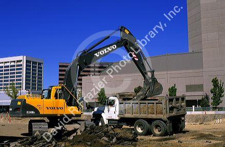 Track power shovel and dump truck on a building construction site in Boise, Idaho.