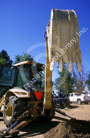 Backhoe bucket with teeth on a construction site in Boise, Idaho.