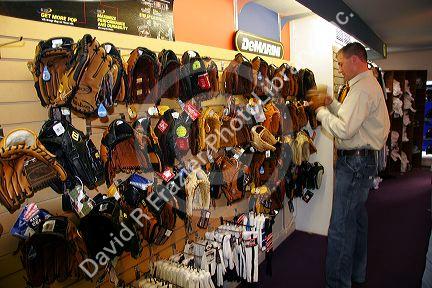 A man shops for a baseball glove at a sporting goods store in Boise, Idaho.