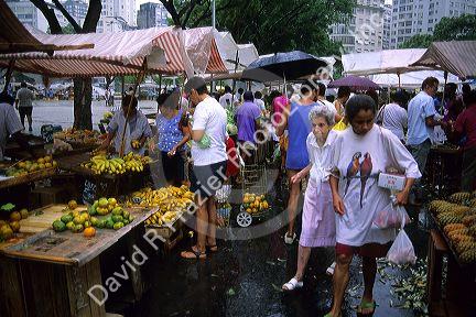 People shop at an outdoor market in Rio de Janeiro, Brazil.