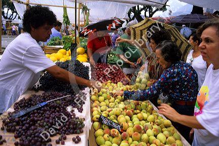 People shop at an outdoor market in Rio de Janeiro, Brazil.
