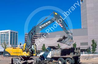 Power shovel loading material into dump truck at Boise, Idaho construction site.