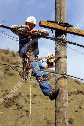 Telephone lineman making repairs.
