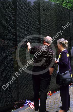 Tourists visit the Vietnam War Memorial in Washington DC.