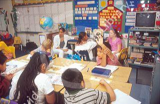 Multi ethnic children in an elementary school classroom.