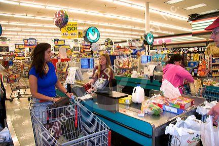 Customer and cashier at Ray's Market Place in Lima, Ohio.