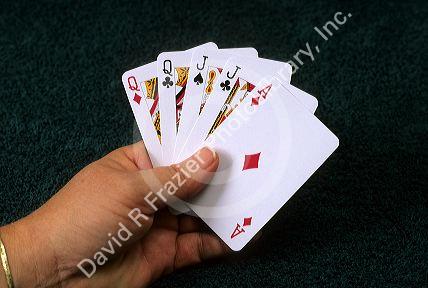 A poker hand of playing cards showing two pair.