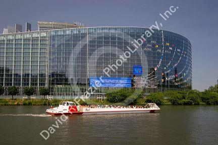 Tour boat on canal in front of the European Union Parliament in Strasbourg, France.