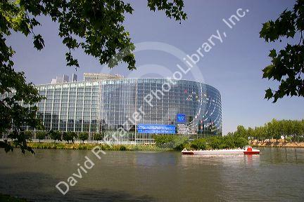 Tour boat on canal in front of the European Union Parliament in Strasbourg, France.