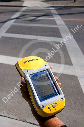 Person holding a handheld GIS device in the field, Boise, Idaho.