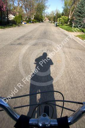 Shadow of a bicyclist in motion.