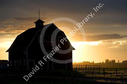 Barn near Burley, Idaho at sunset.