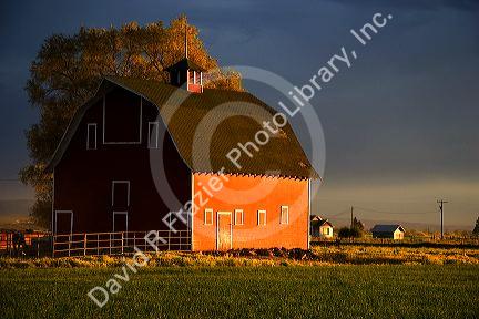 Barn near Burley, Idaho at sunset.