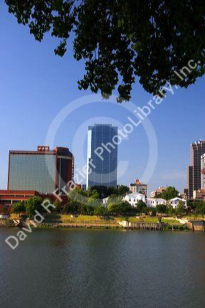 Old Statehouse and modern office buildings along the Arkansas River at Little Rock, Arkansas.