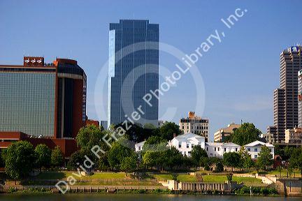 Old Statehouse and modern office buildings along the Arkansas River at Little Rock, Arkansas.