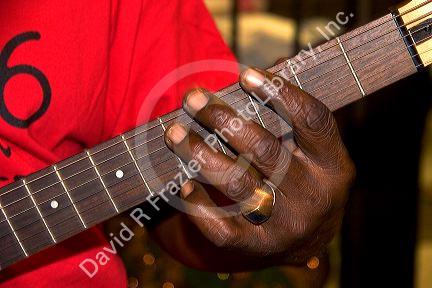 A musician playing an electric guitar on Beale Street in Memphis, Tennessee.