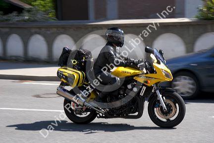 Person riding motorcycle in the alpine village of Garmisch, Germany.