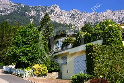 A house in Lichtenstein with the Swiss Alps in the background.