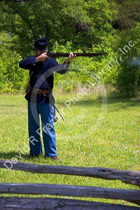Civil war soldier reenactor and park ranger at Shiloh National Park battlefield, Tennessee.