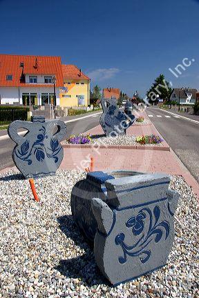 Pottery sculpture at the entrance to the village of Betschdorf, France.