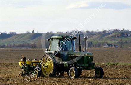 A tractor planting corn seed near Nampa, Idaho.