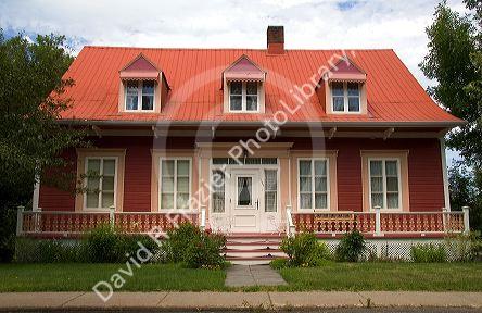 Cottage style homes in a rural area along the St. Lawrence River at L'lslet, Quebec, Canada.